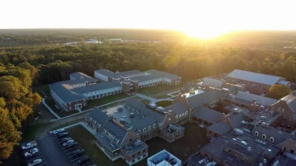 CATS Enrichment Institute campus with basketball courts and soccer fields at sunset